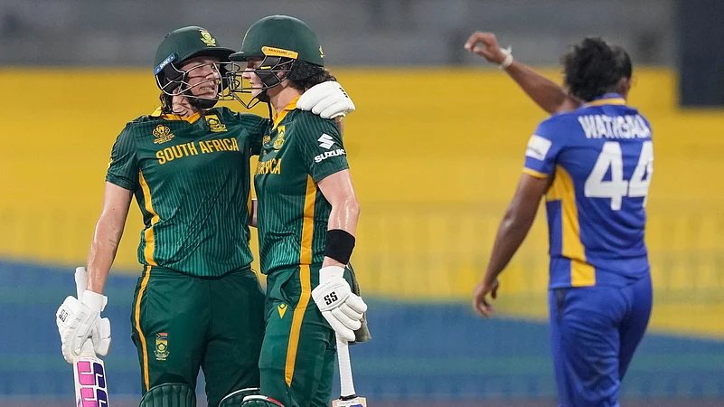 Tazmin Brits and Laura Wolvaardt celebrating after beating Sri Lanka Women by 10 wickets
