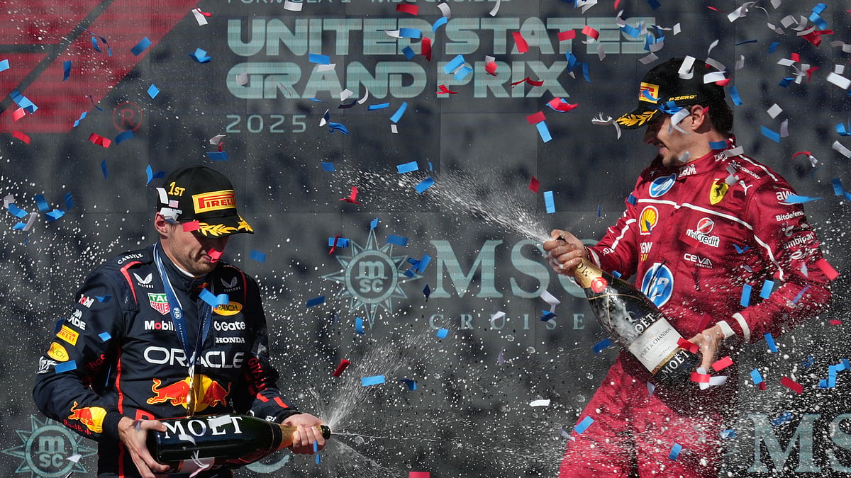 AP/Eric Gay : Race winner Red Bull driver Max Verstappen of the Netherlands, left, celebrates on the podium with third placed Ferrari driver Charles Leclerc of Monaco after the Formula One U.S. Grand Prix