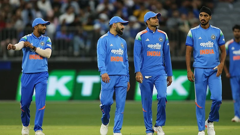 Indian players make their way to the drinks station