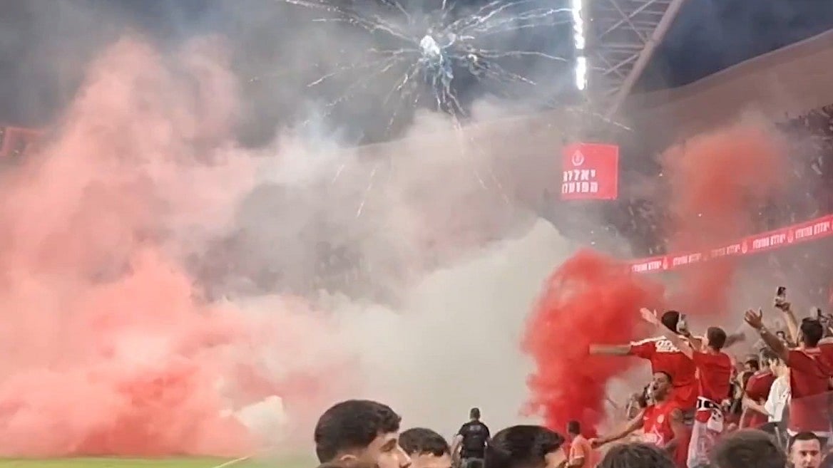 X/Israel Police : A screengrab from a video shared by Israel police of the disturbances before kick-off in the Israeli Premier League derby between Maccabi Tel Aviv and Hapoel Tel Aviv.