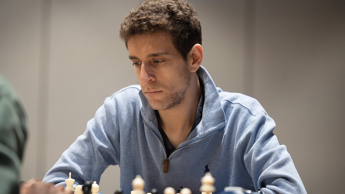 This undated photo released by Charlotte Chess Center shows Daniel Naroditsky playing chess on the board. - Kelly Centrelli/Charlotte Chess Center via AP