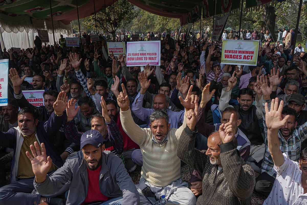 Credits- IMAGO / NurPhoto : Jammu And Kashmir Employees Joint Action Committee Held A Convention In Srinagar Daily wagers and casual laborers from various government departments shout slogans during a convention demanding the regularization of their services and a salary hike in Srinagar, Jammu and Kashmir, on October 16, 2025.