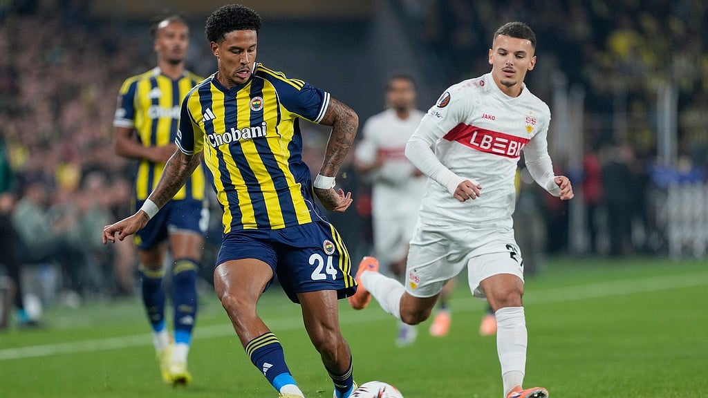 Photo: AP : Fenerbahce Vs VfB Stuttgart Live Score, UEFA Europa League: Jayden Oosterwolde, left, plays the ball next to Badredine Bouanani during the Europa League match between Fenerbahce and Stuttgart, in Istanbul.