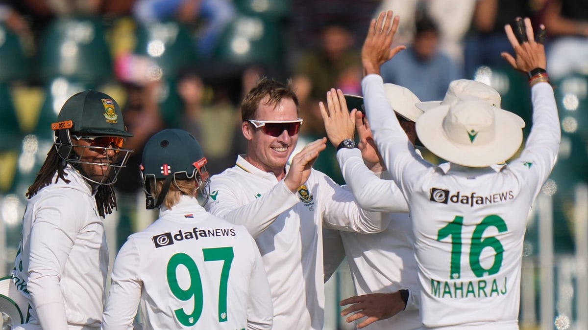 AP : South African players celebrate a fall of Pakistan wicket at Rawalpindi.