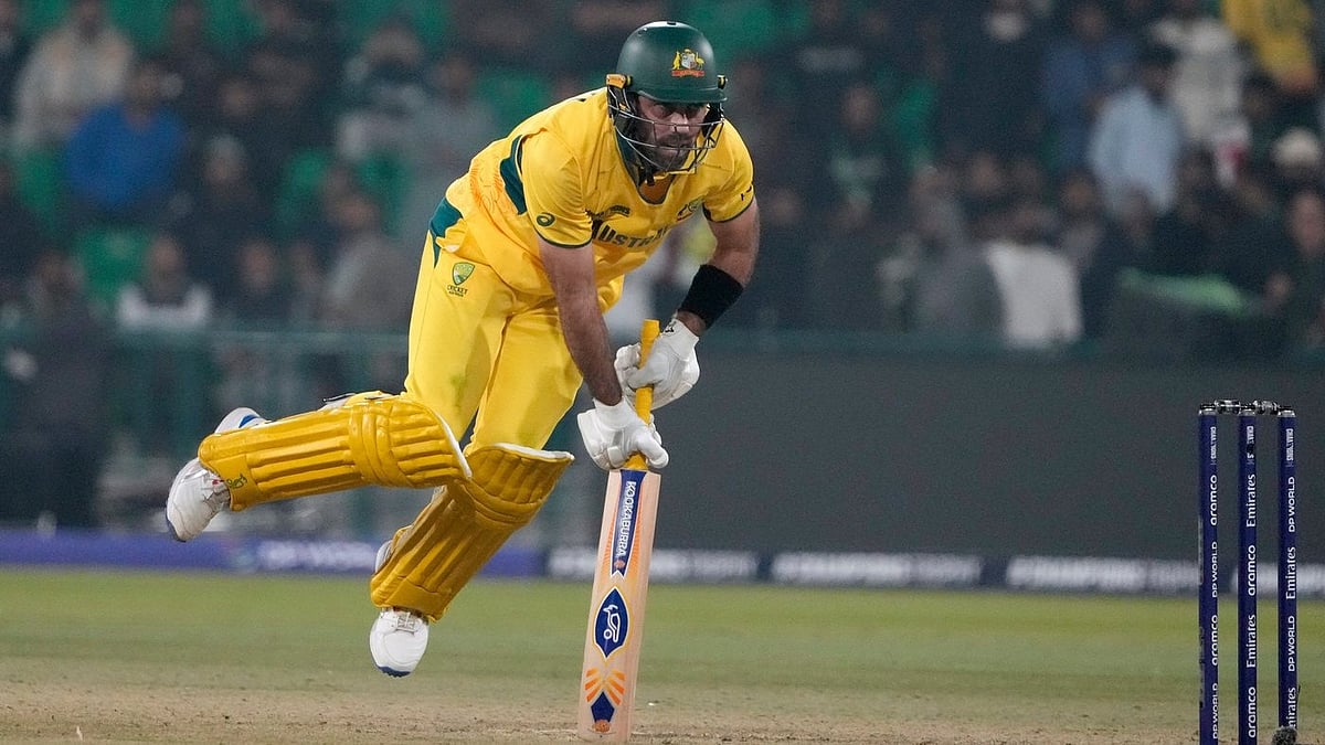 | Photo: AP/K.M. Chaudary : Australia's Glenn Maxwell consoles his balance after playing a shot for boundary during the ICC Champions Trophy cricket match between Australia and England, in Lahore, Pakistan, on Feb. 22, 2025. 