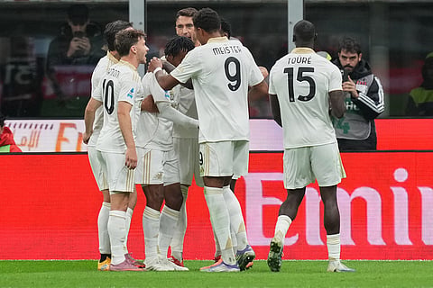 Pisa players celebrate after a goal during the Serie A soccer match between AC Milan and Pisa in Milan, Italy.