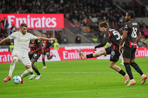 AC Milan's Alexis Saelemaekers shoots during the Serie A soccer match between AC Milan and Pisa in Milan, Italy.