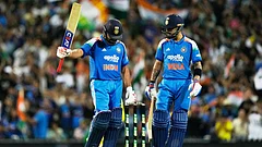 India Vs Australia Highlights, 3rd ODI: Rohit Sharma, left, raises his bat after making 100 runs against Australia as teammate Virat Kohli watches on in Sydney. - Photo: AP