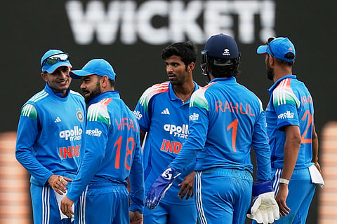 India players celebrates after Virat Kohli, second left, caught out Australia Matthew Short during their One Day International cricket match in Sydney, Australia.