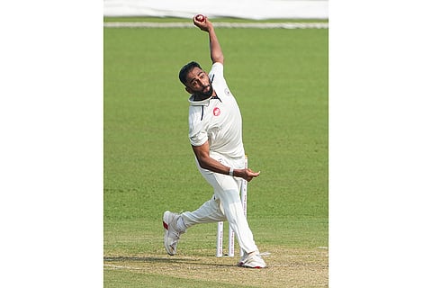 Gujarat's Arzan Nagwaswalla bowls during the first day of the Ranji Trophy cricket match between Bengal and Gujarat, at Eden Gardens, in Kolkata, West Bengal.