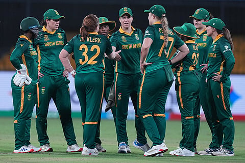South Africa's players celebrates the wicket of Australia's Beth Mooney during the ICC Women's Cricket World Cup match between Australia and South Africa in Indore.
