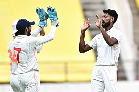 Vidarbha's Praful Hinge celebrates with teammates after dismissing Jharkhand's Shikhar Mohan during the second day of the Ranji Trophy match between Vidarbha and Jharkhand at VCA Stadium, in Nagpur, Maharashtra.