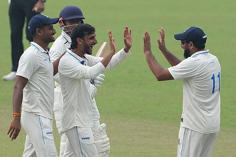 Bengal's Shahbaz Ahmed celebrates with teammates after dismissing Gujarat's Umang Kumar during the second day of the Ranji Trophy cricket match between Bengal and Gujarat, at Eden Gardens, in Kolkata, West Bengal.