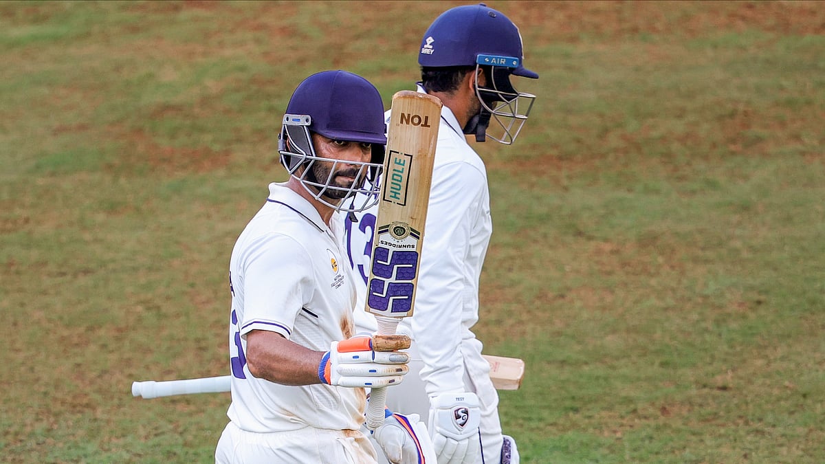 PTI : Mumbai's Ajinkya Rahane celebrates his century on day one of the Ranji Trophy match between Mumbai and Chhattisgarh, at the Sharad Pawar Cricket Academy in Mumbai.
