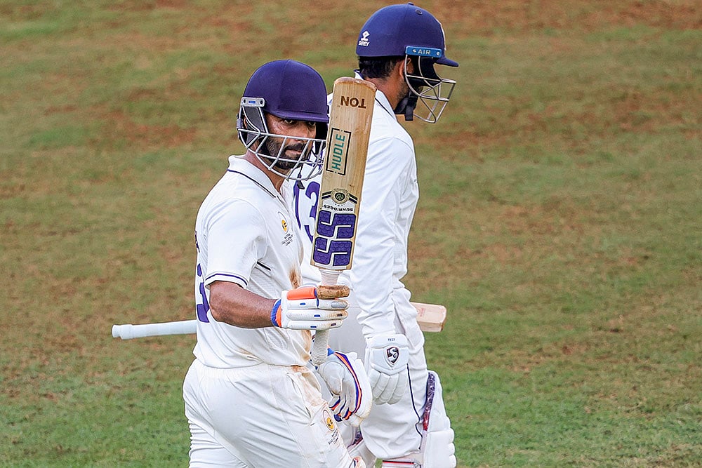 | Photo: PTI : Mumbai’s Ajinkya Rahane celebrates his century on day one of a Ranji Trophy cricket match between Mumbai and Chhattisgarh, at Sharad Pawar Cricket Academy BKC, in Mumbai.
