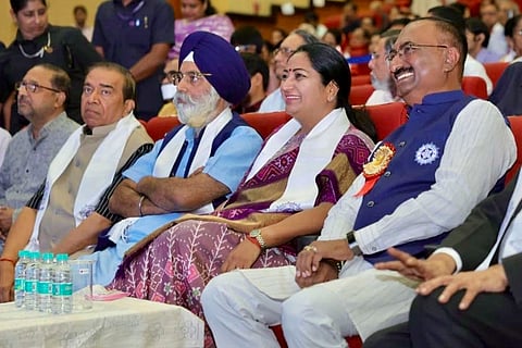 Delhi Chief Minister Rekha Gupta listens to Prime Minister Narendra Modi's 'Mann Ki Baat' radio programme, in New Delhi. 