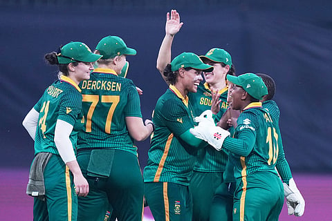 South Africa's players celebrates the wicket of Australia's Ellyse Perry during the ICC Women's Cricket World Cup match between Australia and South Africa in Indore.