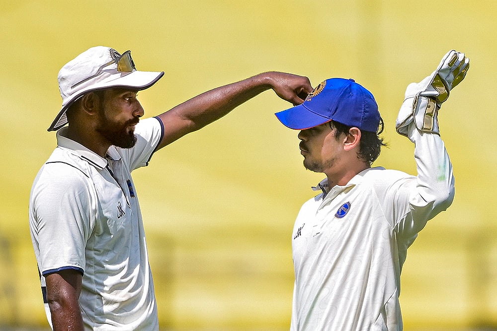 | Photo: PTI : Jharkhand's captain Ishan Kishan, right, with a teammate during the third day of the Ranji Trophy match between Vidarbha and Jharkhand at VCA Stadium, in Nagpur, Maharashtra.
