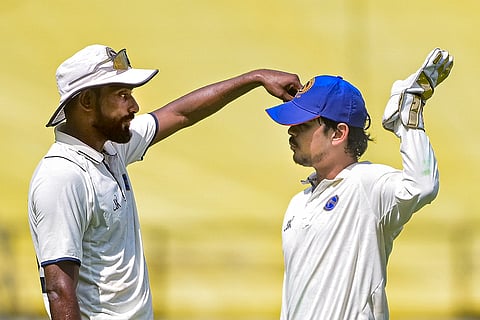 Jharkhand's captain Ishan Kishan, right, with a teammate during the third day of the Ranji Trophy match between Vidarbha and Jharkhand at VCA Stadium, in Nagpur, Maharashtra.