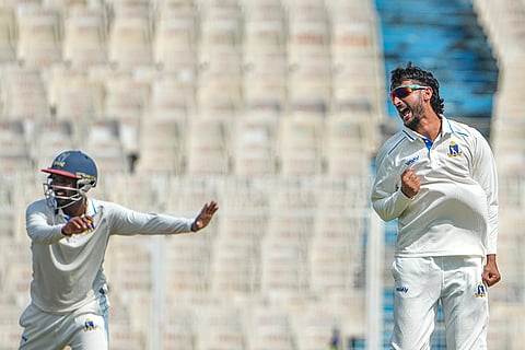 Bengal's Shahbaz Ahmed celebrates after dismissing Gujarat's Arzan Nagwaswalla on Day 3 of the Ranji Trophy cricket match between Bengal and Gujarat, at Eden Gardens, in Kolkata.
