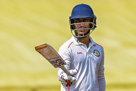 Vidarbha's Aman Mokhade celebrates his half-century during the third day of the Ranji Trophy match between Vidarbha and Jharkhand at VCA Stadium, in Nagpur, Maharashtra.