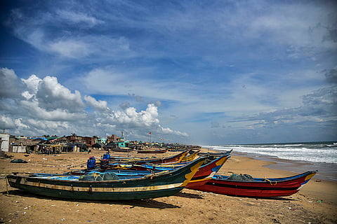 Boats parked on a beach as a precautionary measure against Cyclone 'Montha', in Puri.
