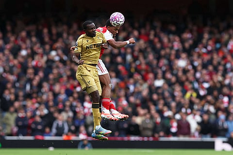Crystal Palace's Tyrick Mitchell, left, jumps for the ball with Arsenal's Jurrien Timber during the English Premier League soccer match between Arsenal and Crystal Palace in London.