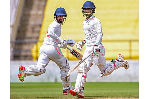 Vidarbha's Aman Mokhade and Atharva Taide sprint between wickets during the third day of the Ranji Trophy match between Vidarbha and Jharkhand at VCA Stadium, in Nagpur, Maharashtra.