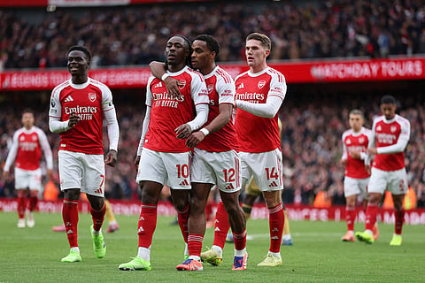 Arsenal's Eberechi Eze, second left, celebrates with his teammates after scoring his side's opening goal during the English Premier League soccer match between Arsenal and Crystal Palace in London.