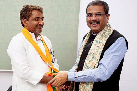 Union Minister Dharmendra Pradhan felicitates former Jan Suraaj Party leader Bijendra Thakur as the latter joins BJP, ahead of the Bihar Assembly elections, in Patna.