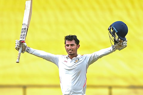 Vidarbha's Aman Mokhade celebrates his century during the third day of the Ranji Trophy 2025-26 cricket match between Vidarbha and Jharkhand, in Nagpur.