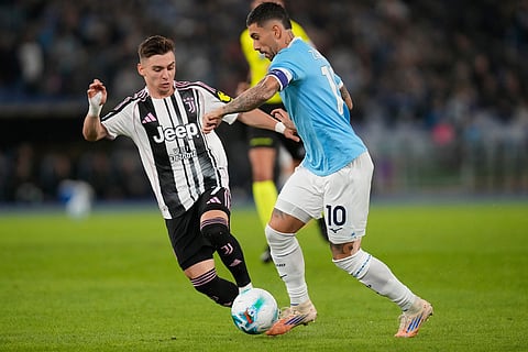 Juventus' Francisco Conceicao, left, and Lazio's Mattia Zaccagni fight for the ball during the Italian Serie A soccer match between Lazio and Juventus in Rome.