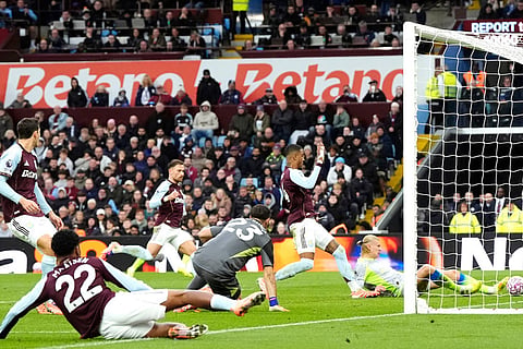 Manchester City's Erling Haaland scores a goal before being ruled out for offside during the English Premier League match between Aston Villa and Manchester City, in Birmingham, England.