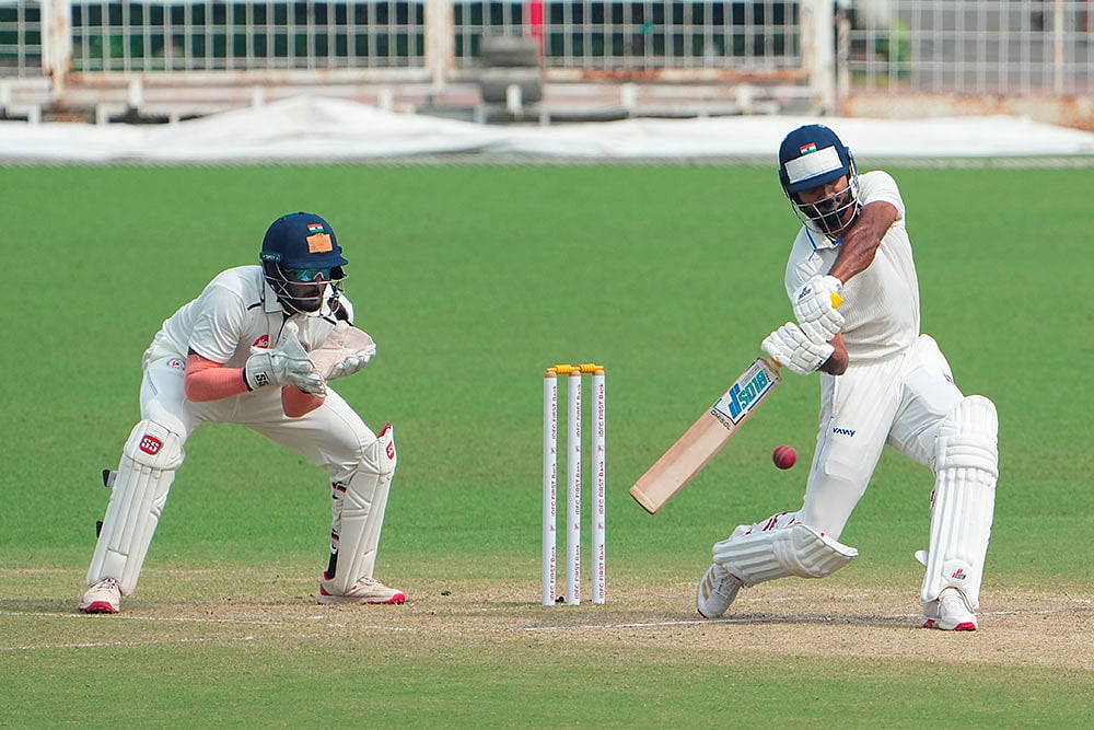 | Photo: PTI/Swapan Mahapatra : Bengal's Akash Deep plays a shot during the fourth day of the Ranji Trophy 2025-26 cricket match between Bengal and Gujarat, at Eden Gardens, in Kolkata.