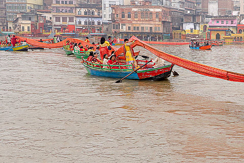 People cover the holy River Yamuna with sarees during 'Chunari Manorath' festival, in Mathura, Uttar Pradesh.