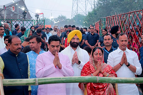 In this image posted on Oct. 28, 2025, Delhi Chief Minister Rekha Gupta with cabinet ministers Manjinder Singh Sirsa, Ravinder Singh (Indraj) and Kapil Mishra offers prayers on the last day of the 'Chhath Puja' festival celebrations, at Hathi ghat, in New Delhi.