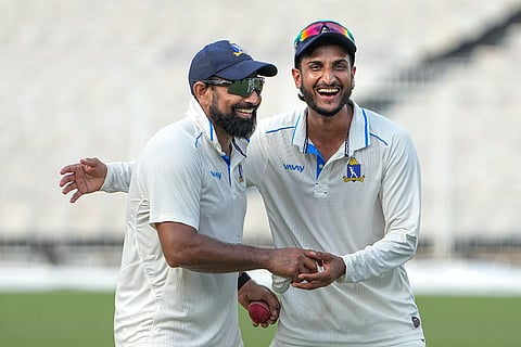 Bengal's Mohammed Shami and Shahbaz Ahmed celebrate after clinching victory on the fourth day of the Ranji Trophy match against Gujarat, at Eden Gardens, Kolkata.