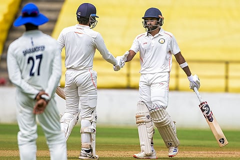 Vidarbha's Ravikumar Samarth being congratulated on his half century on the fourth and last day of the Ranji Trophy 2025-26 cricket match between Vidarbha and Jharkhand, in Nagpur, Maharashtra