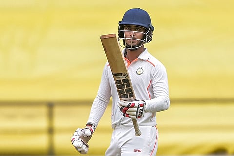 Vidarbha's Aman Mokhade celebrates after completing 150 runs during the fourth day of the Ranji Trophy match between Vidarbha and Jharkhand at VCA Stadium, in Nagpur, Maharashtra.