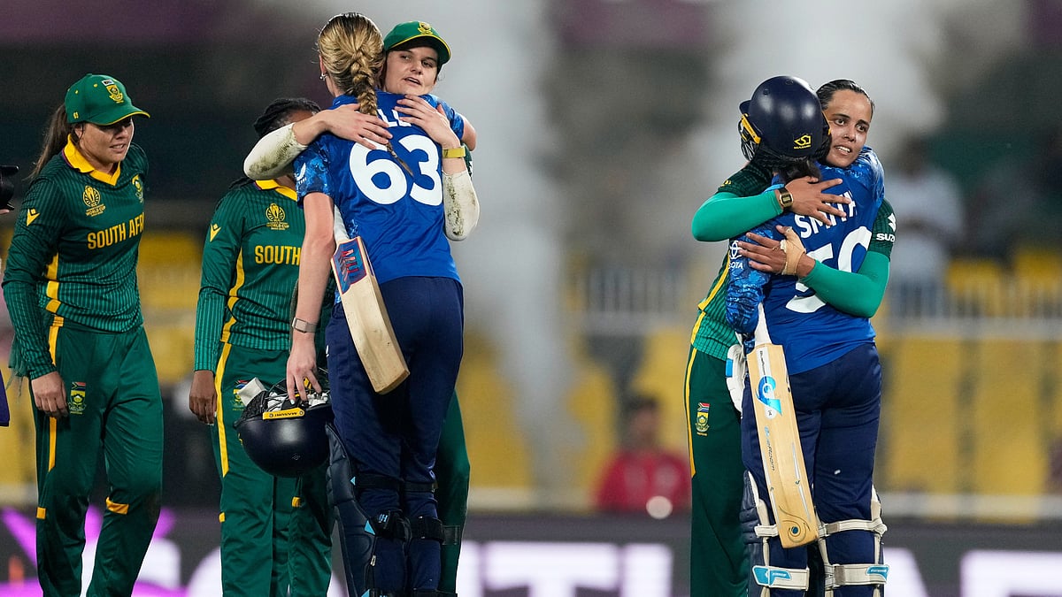 AP Photo/Anupam Nath : South Africa's players with England's players celebrate after winning the ICC Women's Cricket World Cup first semifinal match between England and South Africa at Barsapara Cricket Stadium in Guwahati, India, Thursday, Oct. 29, 2025