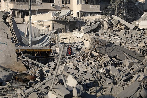 Palestinians try to recover a body from the rubble of a house destroyed in an overnight Israeli strike Palestinians try to recover a body from the rubble of a house destroyed in an overnight Israeli strike, in Gaza City, on October 29, 2025. 