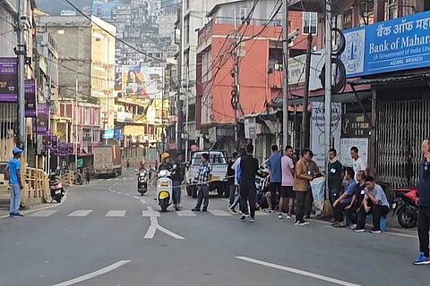 MNF calls 10-hr shutdown in Mizoram: People gather outside a closed bank during a 10-hour total shutdown across the state barring Mamit district, called by the Mizo National Front (MNF) to protest the extension of the Forest (Conservation) Amendment Act (FCAA), 2023, in Aizawl, Mizoram.