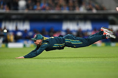 Josh Philippe of Australia dives as he attempts to take a catch during during the T20 cricket international between India and Australia in Canberra, Australia.