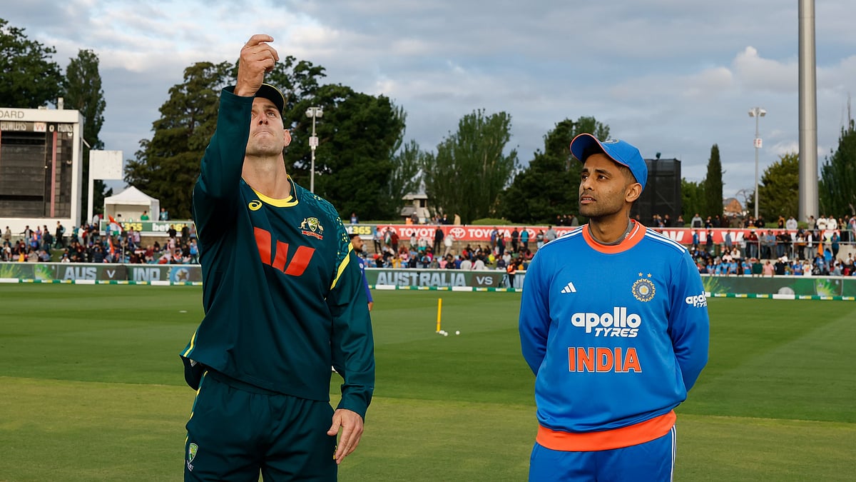 | Photo: X/BCCI : Australia's captain Mitchell Marsh and India's captain Suryakumar Yadav at the toss during the first T20I match at Manuka Oval, Canberra, on October 29, 2025.