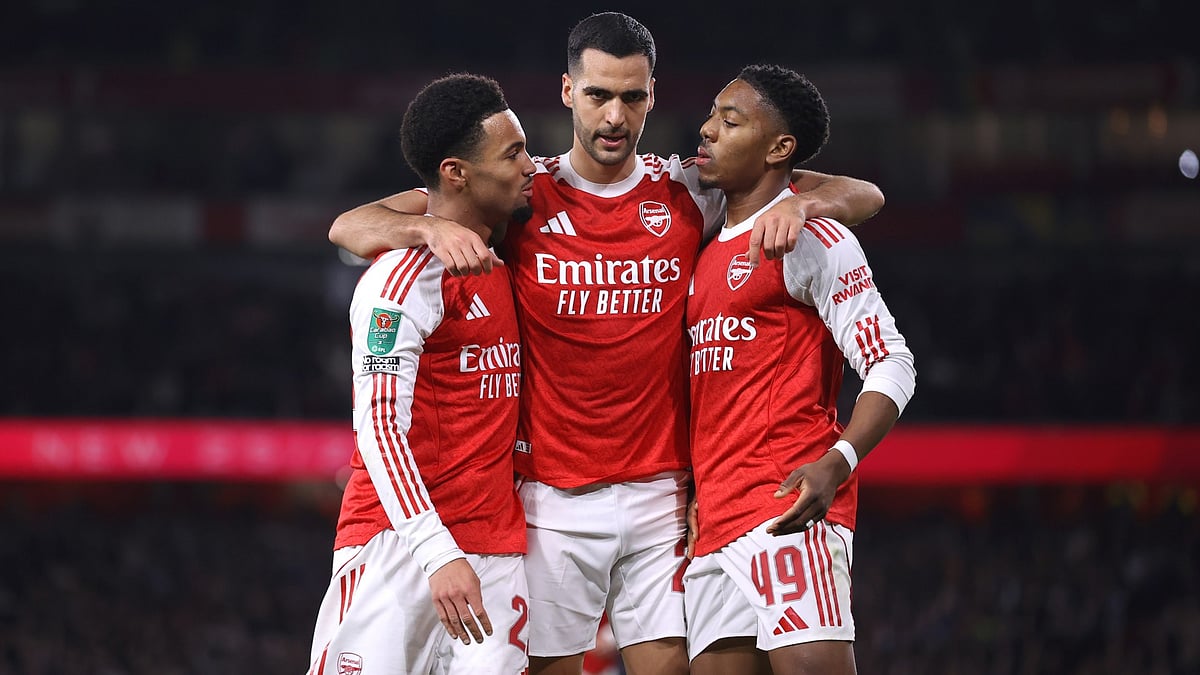 Ethan Nwaneri celebrates his opener with Mikel Merino and Myles Lewis-Skelly