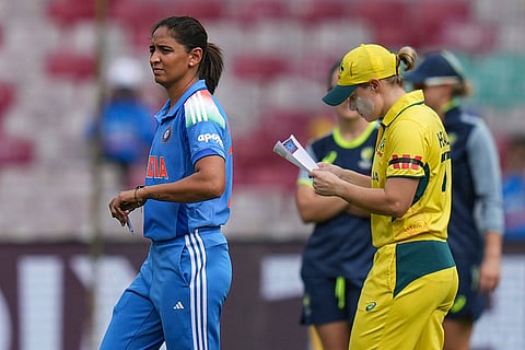 Australia’s captain Alyssa Healy and India's captain Harmanpreet Kaur during the toss before the start of the ICC Women's World Cup semifinal ODI cricket match between India Women and Australia Women, at the DY Patil Stadium, in Navi Mumbai/