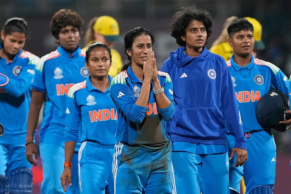 | Photo: AP/Rajanish Kakade : India's Jemimah Rodrigues, centre, celebrates after winning the ICC Women's Cricket World Cup cricket semi final against Australia in Navi Mumbai.