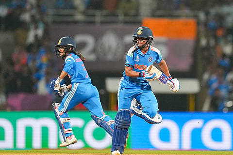 India's captain Harmanpreet Kaur, front, and Jemimah Rodrigues run between the wickets during an ICC Women's World Cup semifinal ODI cricket match between India Women and Australia Women, at the DY Patil Stadium, in Navi Mumbai.