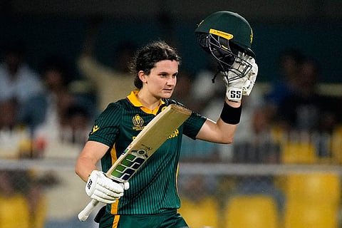 South Africa's captain Laura Wolvaardt celebrates her century during the ICC Women's Cricket World Cup first semifinal match between England and South Africa at Barsapara Cricket Stadium in Guwahati.