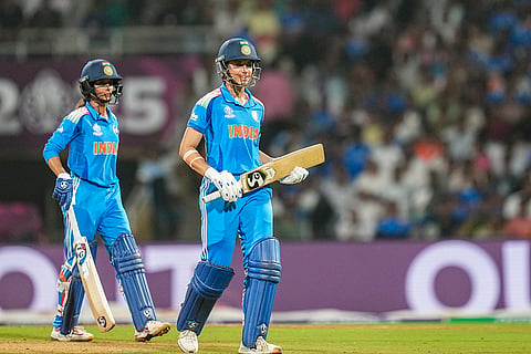 India's Smriti Mandhana, right, returns to pavilion after her dismissal during an ICC Women's World Cup semifinal ODI cricket match between India Women and Australia Women, at the DY Patil Stadium, in Navi Mumbai.